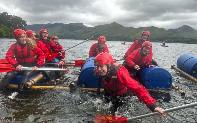 People laughing on a raft on Derwentwater