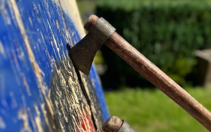 Axe embedded in a target