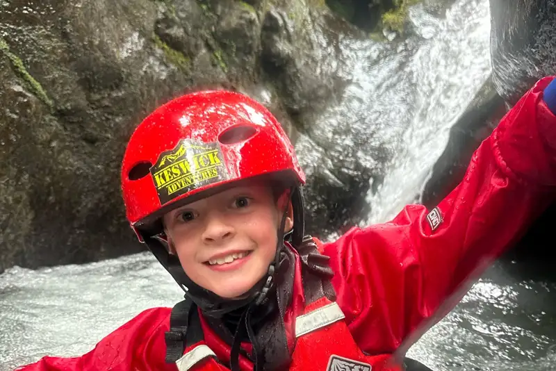 Boy posing and smiling in the ghyll