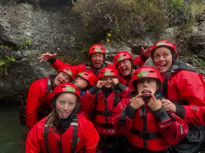 Family group pulling faces in the ghyll