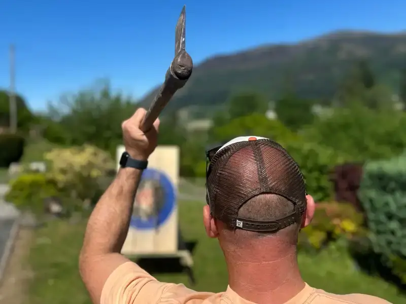 Man throwing an axe at a target