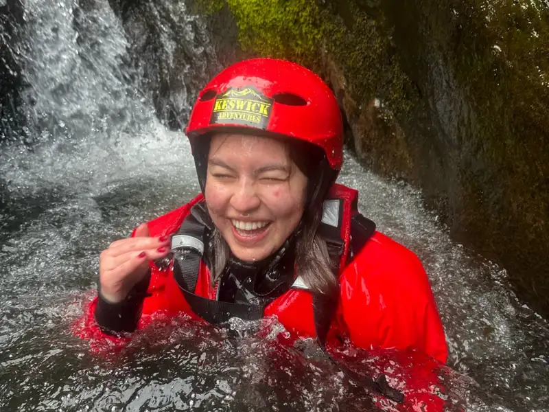 Woman laughing in a ghyll