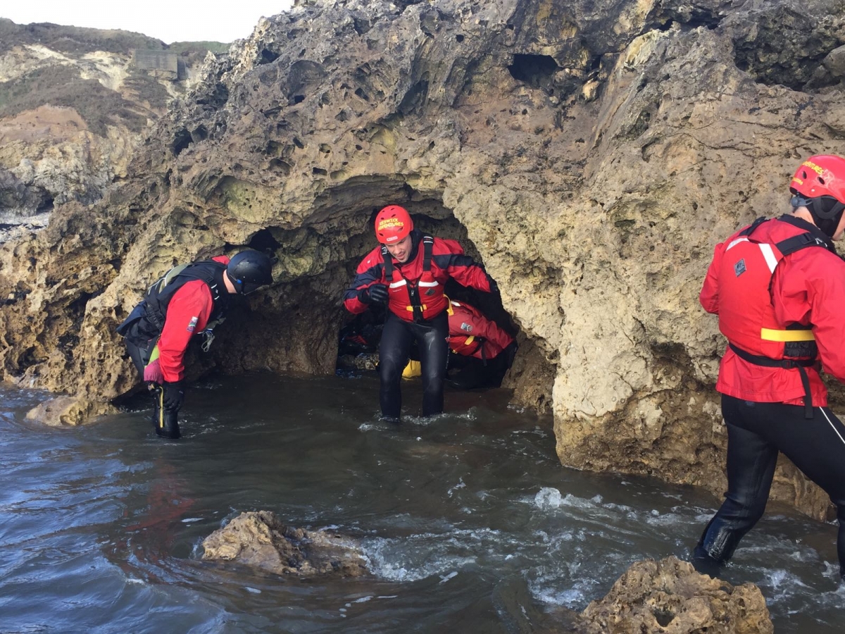 Exploring caves during coasteering in the North East