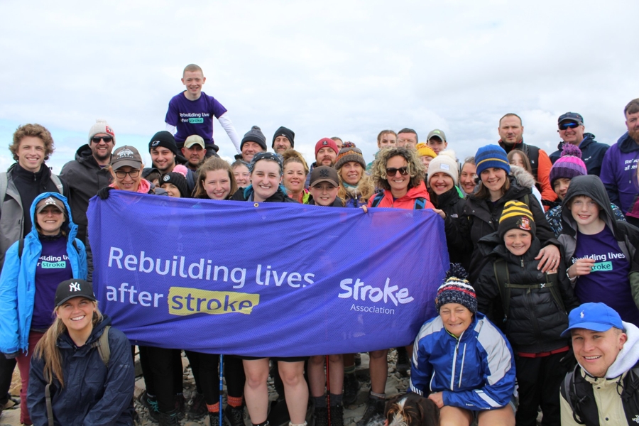 Walkers with Stroke Association Banner on Scafell Pike