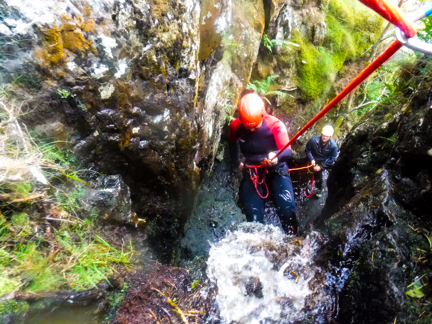 Abseiling while canyoning