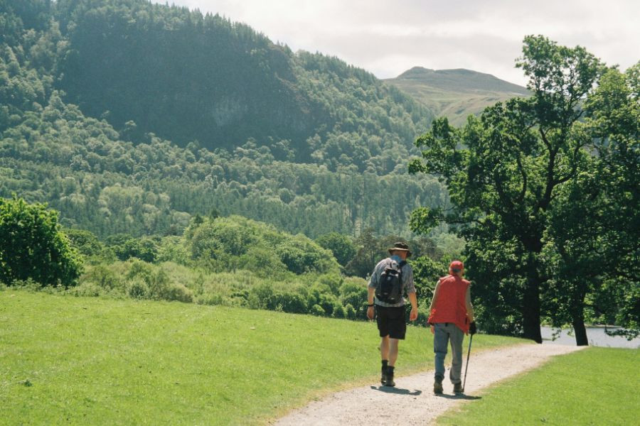 Two people working along a footpath near Keswick