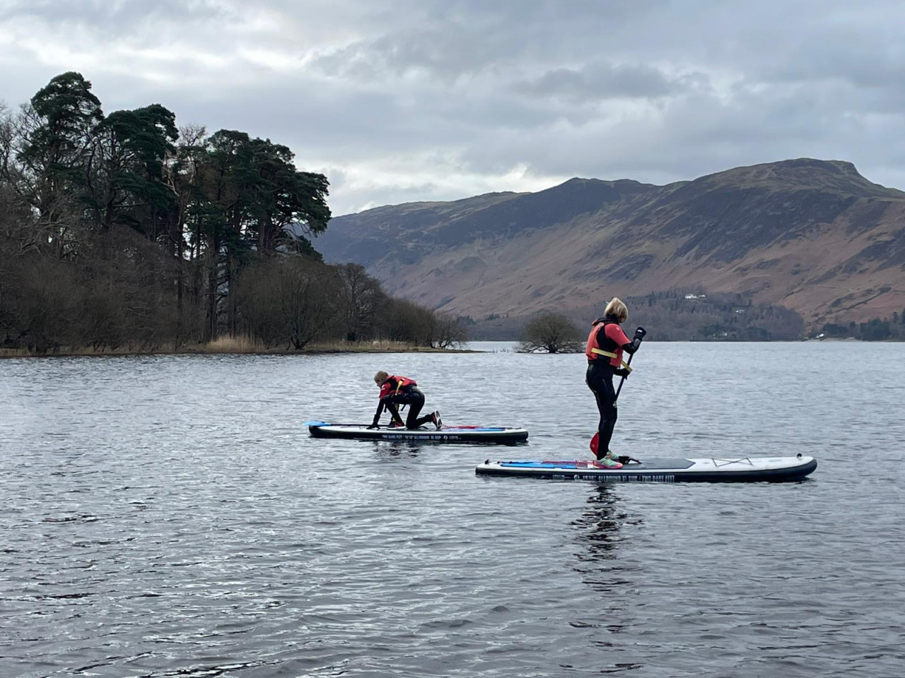 Two people paddleboarding on Derwentwater