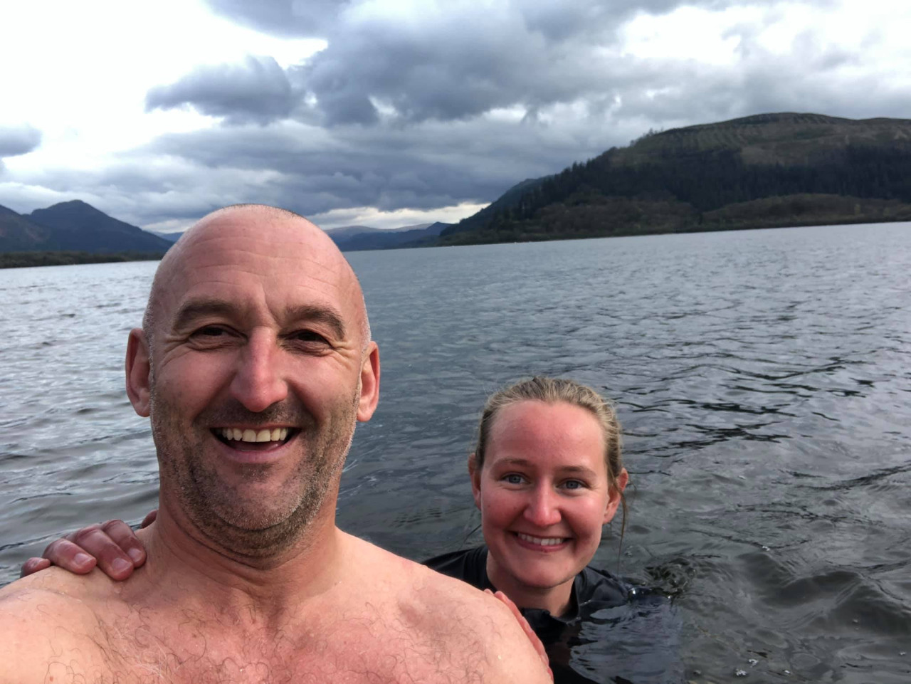Becca and Lee from the Keswick Adventures team swimming in Derwentwater
