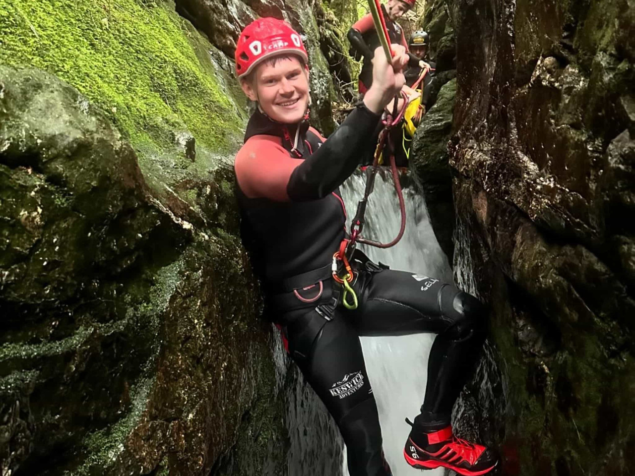 A man canyoning in the Lake District